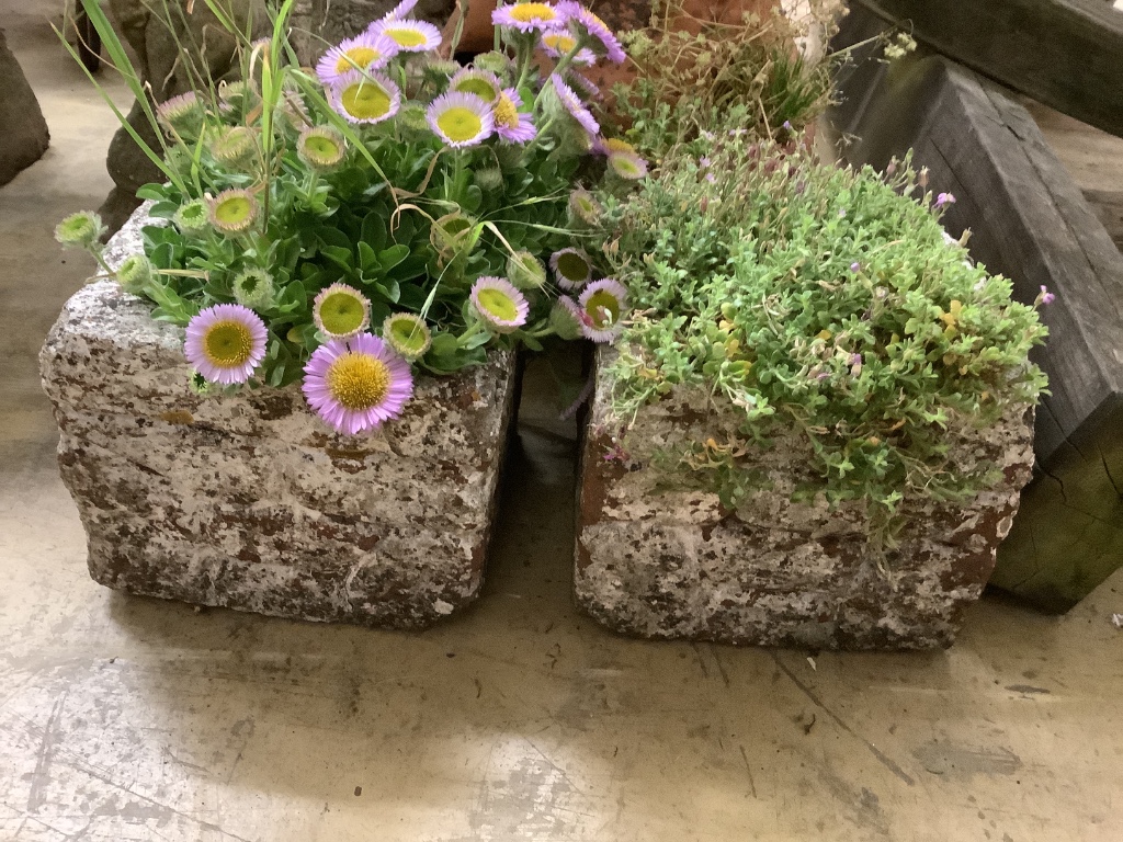 A terracotta strawberry pot, height 56cm together with a pair of stone square garden planters, width 22cm, height 19cm